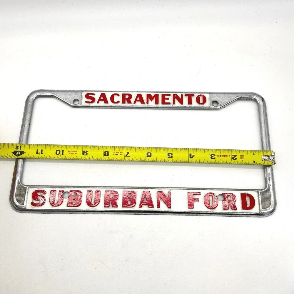 Vintage Suburban Ford Sacramento License Plate Frame Chrome Red White Metal
